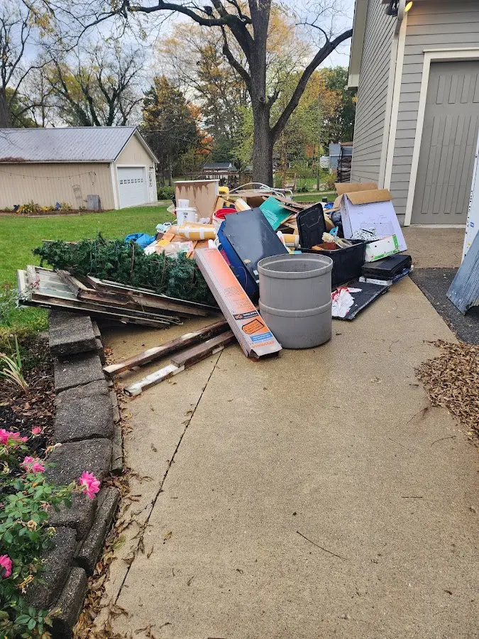 Dumpster being loaded with debris for Residential Dumpster Rental in Sugar Creek